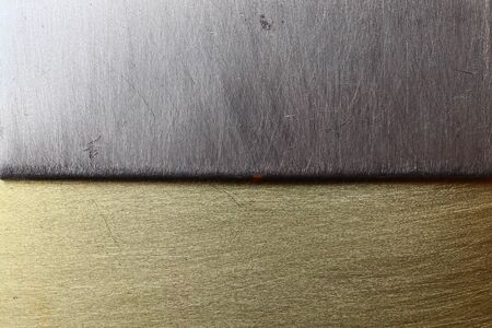 Two different textures steel and bronze, background divided into two partsの写真素材