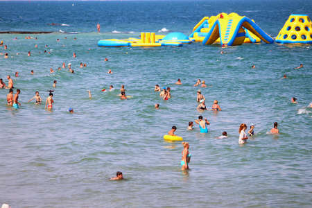 Odessa, Ukraine July 26, 2019,People on the city beach sunbathe in the midst of the tourist season . Editorial Use Onlyのeditorial素材