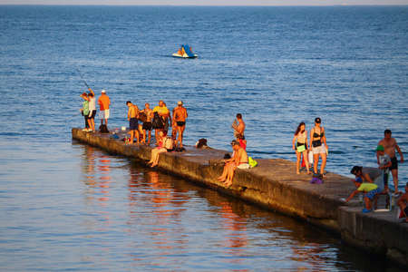 Odessa, Ukraine July 27, 2019, People on the city beach sunbathe in the midst of the tourist season. Editorial Use Onlyのeditorial素材