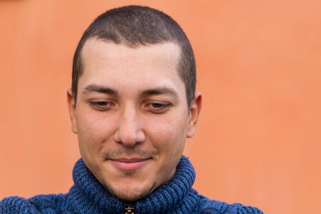 Face of a smiling happy young manの写真素材