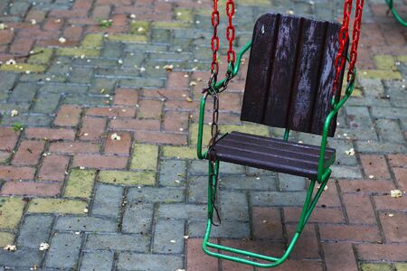 Swing on a chain in the playground. No one in the period of lockdownの写真素材