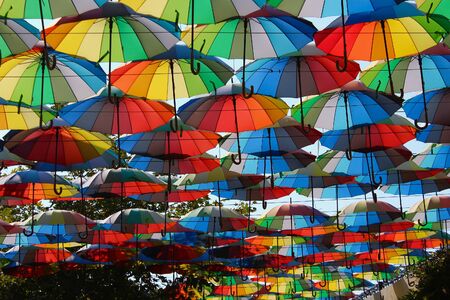 Beautiful bright multi-colored umbrellas, a symbol of summer tourism backgroundの写真素材