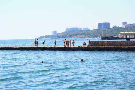 Odessa, Ukraine July 20, 2019, People on the city beach sunbathe in the midst of the tourist season...
