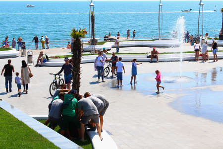 Odessa, Ukraine July 20, 2019, People on the city beach sunbathe in the midst of the tourist season . Editorial Use Onlyのeditorial素材