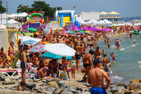 Odessa, Ukraine July 20, 2019, People on the city beach sunbathe in the midst of the tourist season . Editorial Use Onlyのeditorial素材