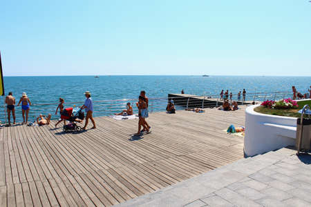Odessa, Ukraine July 20, 2019, People on the city beach sunbathe in the midst of the tourist season . Editorial Use Onlyのeditorial素材
