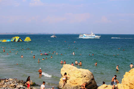 Odessa, Ukraine July 26, 2019,People on the city beach sunbathe in the midst of the tourist season . Editorial Use Onlyのeditorial素材