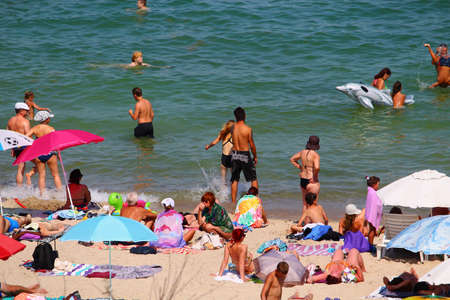 Odessa, Ukraine July 28, 2019, People on the city beach sunbathe in the midst of the tourist season. Editorial Use Onlyのeditorial素材