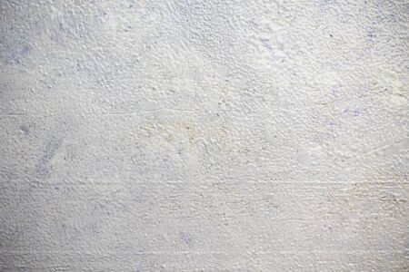 Light wooden texture painted with a sponge with a characteristic pattern. Grunge background