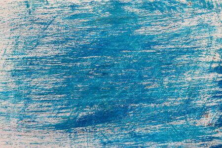 The texture surface of a scratched wooden board with peeling paint. Background. Grunge copy spaceの写真素材
