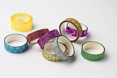 Rolls with scotch tape and decorative adhesive tapes for decorating gifts for the holidays. Backgroundの写真素材