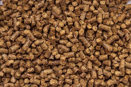 Natural environmentally friendly wood filler for animal toilet. Most often used for cats. Background