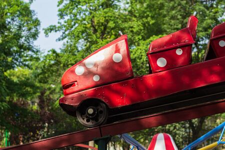 Empty cars of carousels in an amusement park due to a pandemic. Backgroundの写真素材