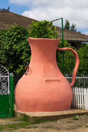Drinking a manual pitcher-shaped well in front of the house. Symbol of hospitality. The traditional culture of wine villages. Backgroundの写真素材