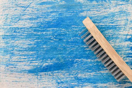 Brush with metal pile for brushing wood. Hand toolの写真素材