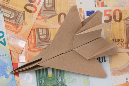 Origami paper airplane mockup. Selective focus. Against the background of the Euroの写真素材