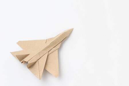 Origami paper airplane mockup. Selective focus. Light background