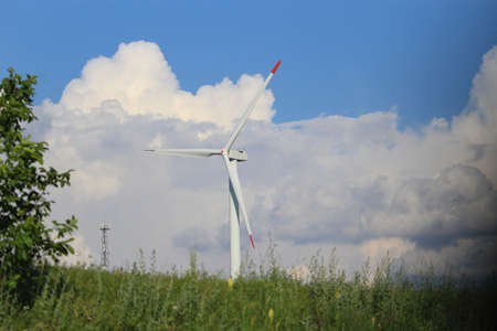 Wind generator of electricity against the sky. The use of clean green renewable energy in real life....
