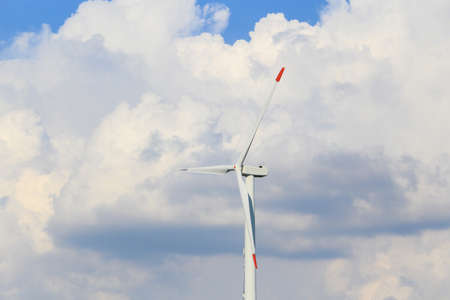 Wind generator of electricity against the sky. The use of clean green renewable energy in real life....