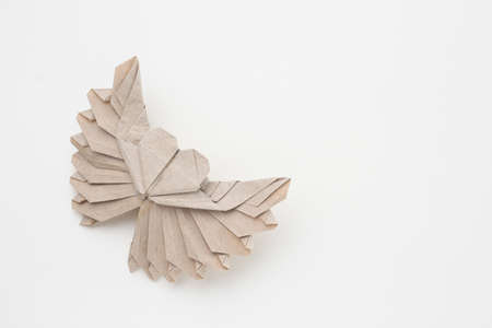 Origami paper sailboat mockup. Selective focus. Light backgroundの写真素材