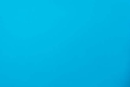 Abstract background from colored blue cardboard. A substrate blank or graphic design resource.の写真素材