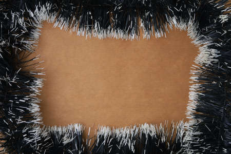 Craft paper surrounded by rain. Abstract New Year or Christmas background, selective focus.の写真素材