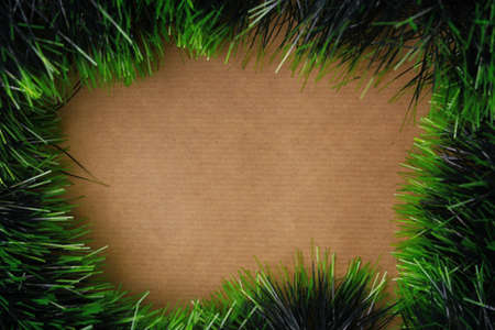 Craft paper surrounded by rain. Abstract New Year or Christmas background, selective focus.