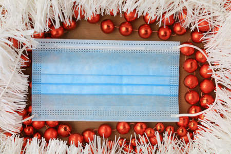 Medical surgical mask as a symbol of the year. Abstract Christmas background, selective focus