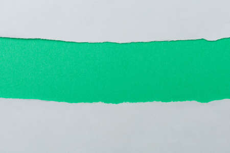 The torn paper forms an abstract background with copy space.の写真素材