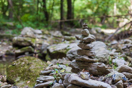 Pyramid of stones. Selective focus with copy space. Travel and hiking concept.の写真素材