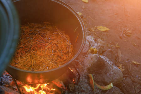 Abstract background on the theme of cooking in a camping or hiking setting. Selective focus with...