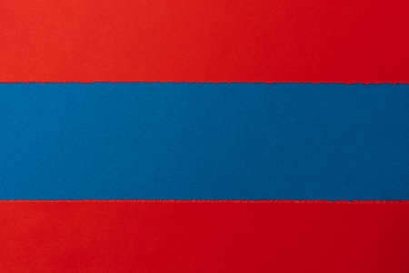 The torn paper forms an abstract background with copy space.