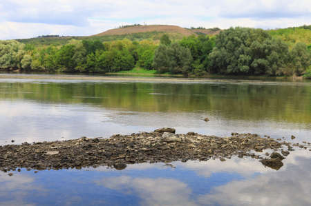 Very beautiful river water surface. Natural green background. Selective focus