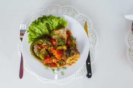 Sea fish stewed with vegetables. Cooking healthy dietary meals at home during the covid-19 lockdown....
