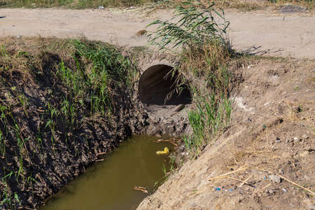 Drainage channel for rainwater on the outskirts of the city. Background