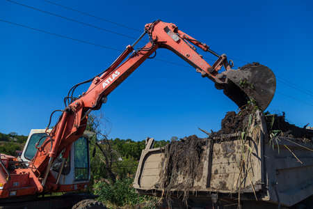 September 14, 2020 Balti or Beltsy Moldova works on deepening and cleaning the rainwater drainage channel. Illustrative editorial universal backgroundのeditorial素材