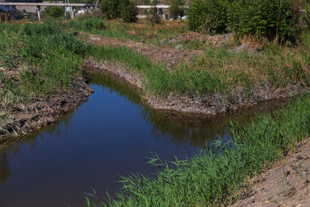 Drainage channel for rainwater on the outskirts of the city. Backgroundの写真素材