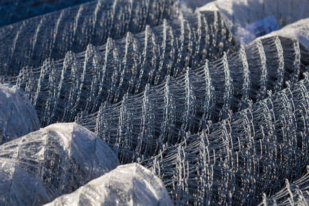 Metal mesh for fast fence construction. Background