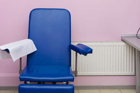 Blue chair with pink background.の写真素材