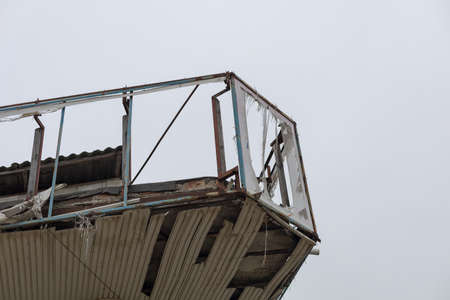 The aftermath of a severe hurricane that damaged rooftops and destroyed advertising banners. Backgroundの写真素材