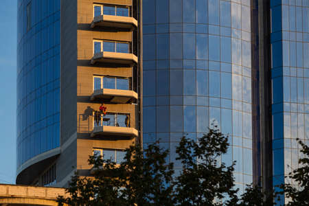 October 19, 2020 Balti Moldova Workers at high-rise finishing works of a multi-storey building. Illustrative editorialのeditorial素材