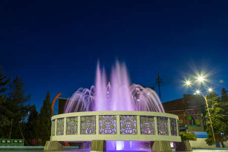 October 19, 2020 Balti Moldova city fountain after sunset. Backgroundのeditorial素材