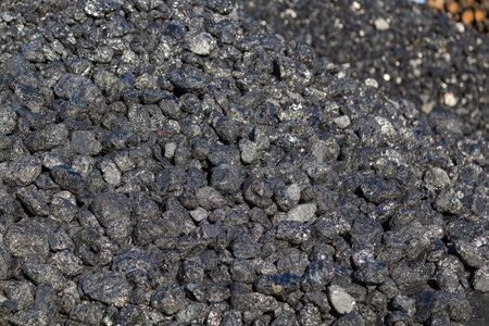 Natural black coals for universal illustrative background. Industrial coals. Used as a household...