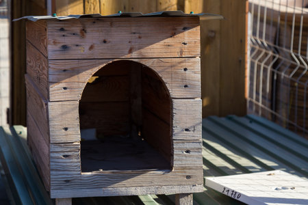 Homemade wooden doghouse or kennel. Background with selective focus