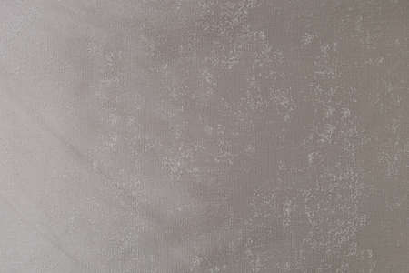 Plain textured factory fabric. Minimalism in light graphite tones with a bronze sheen. Background