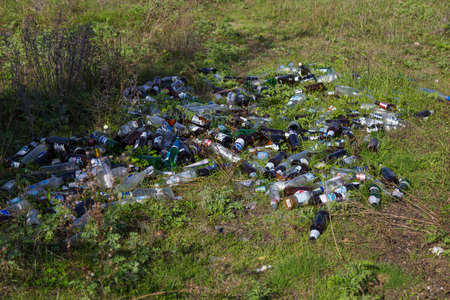 October 15, 2020 Balti or Beltsy Moldova is a huge dump of empty alcohol bottles in nature. Discarded trash after a picnic. Pollution of natureのeditorial素材