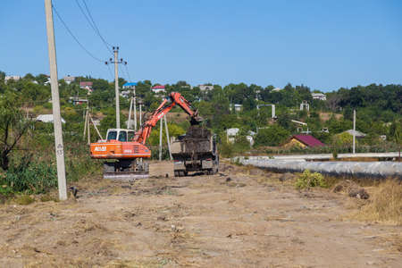 September 14, 2020 Balti or Beltsy Moldova works on deepening and cleaning the rainwater drainage channel. Illustrative editorial universal backgroundのeditorial素材
