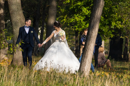 November 8, 2020 Balti Moldova newlyweds on a walk in the park take pictures and shoot a video for memoryのeditorial素材