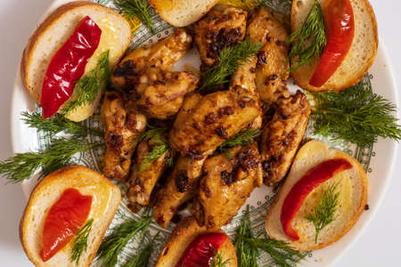 Baked chicken wings. Culinary background