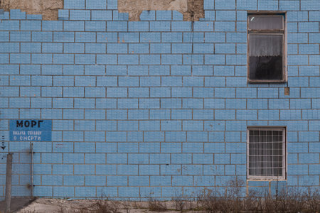 The old scary morgue building. Inscription in Russian - MORGUE ISSUANCE OF DEATH CERTIFICATES. Backgroundの写真素材